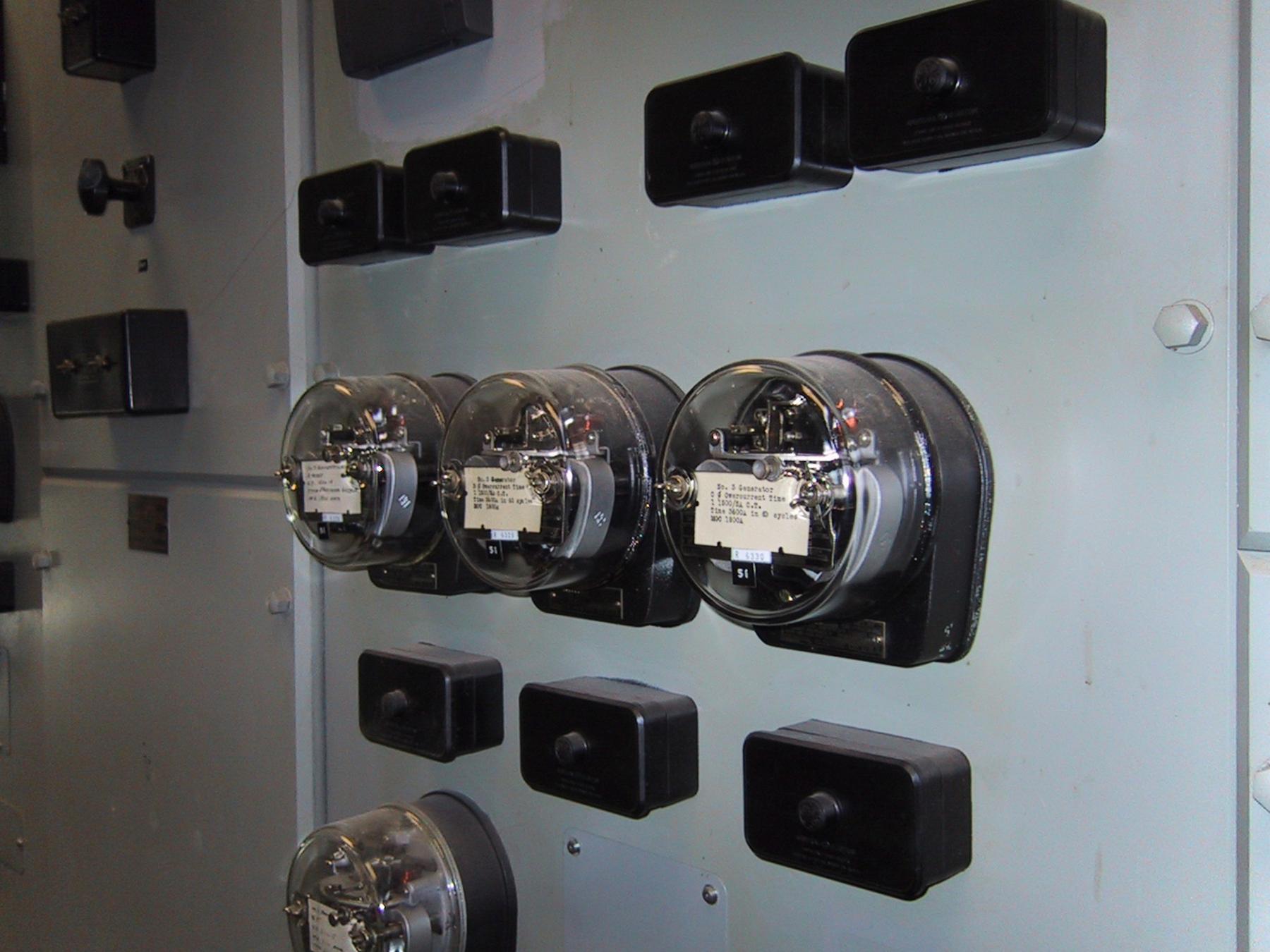Protective Relays Hydroelectric Station - a bunch of black and white electrical equipment